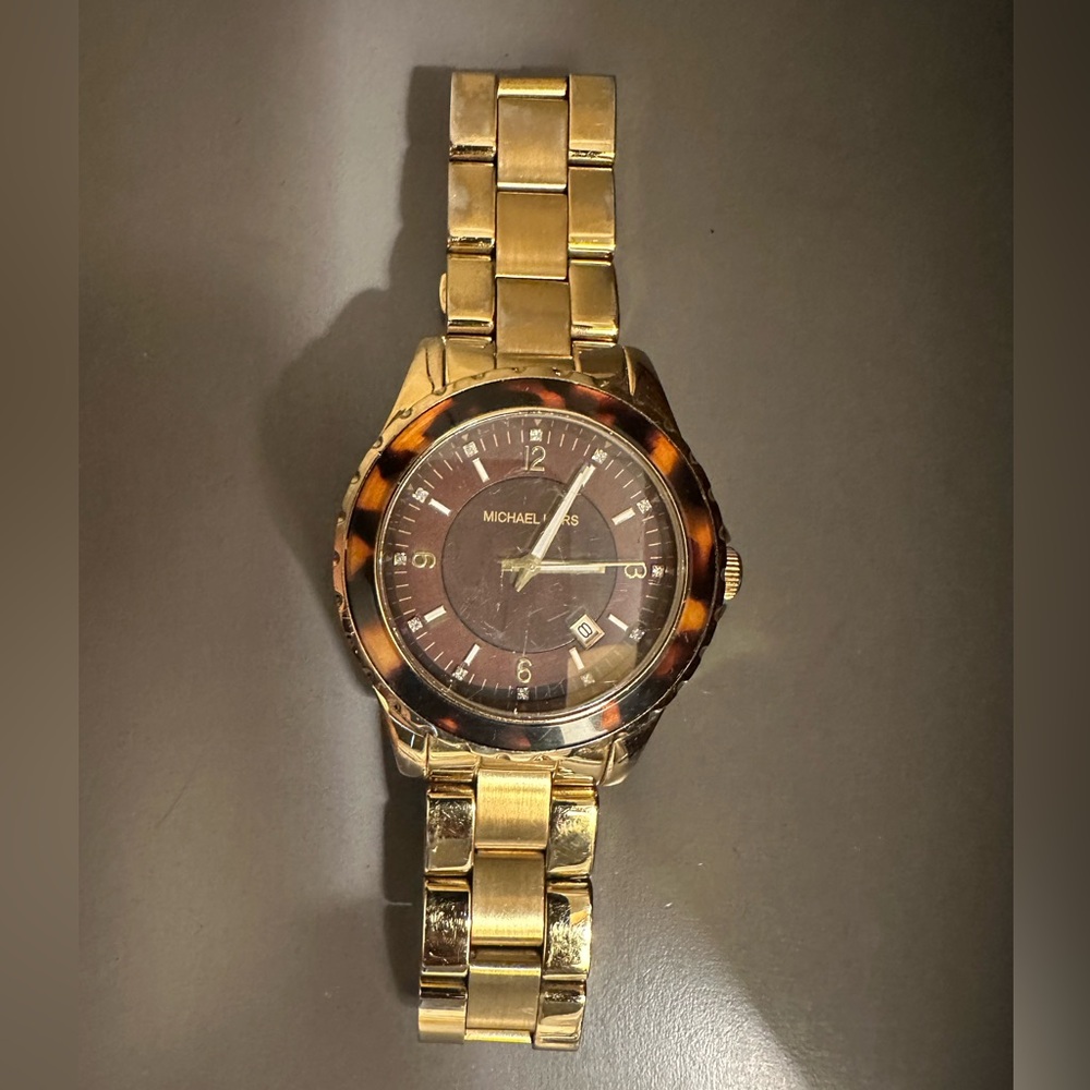 Michael Kors Gold Tone Rotating Animal Print Bezel Date Indicator